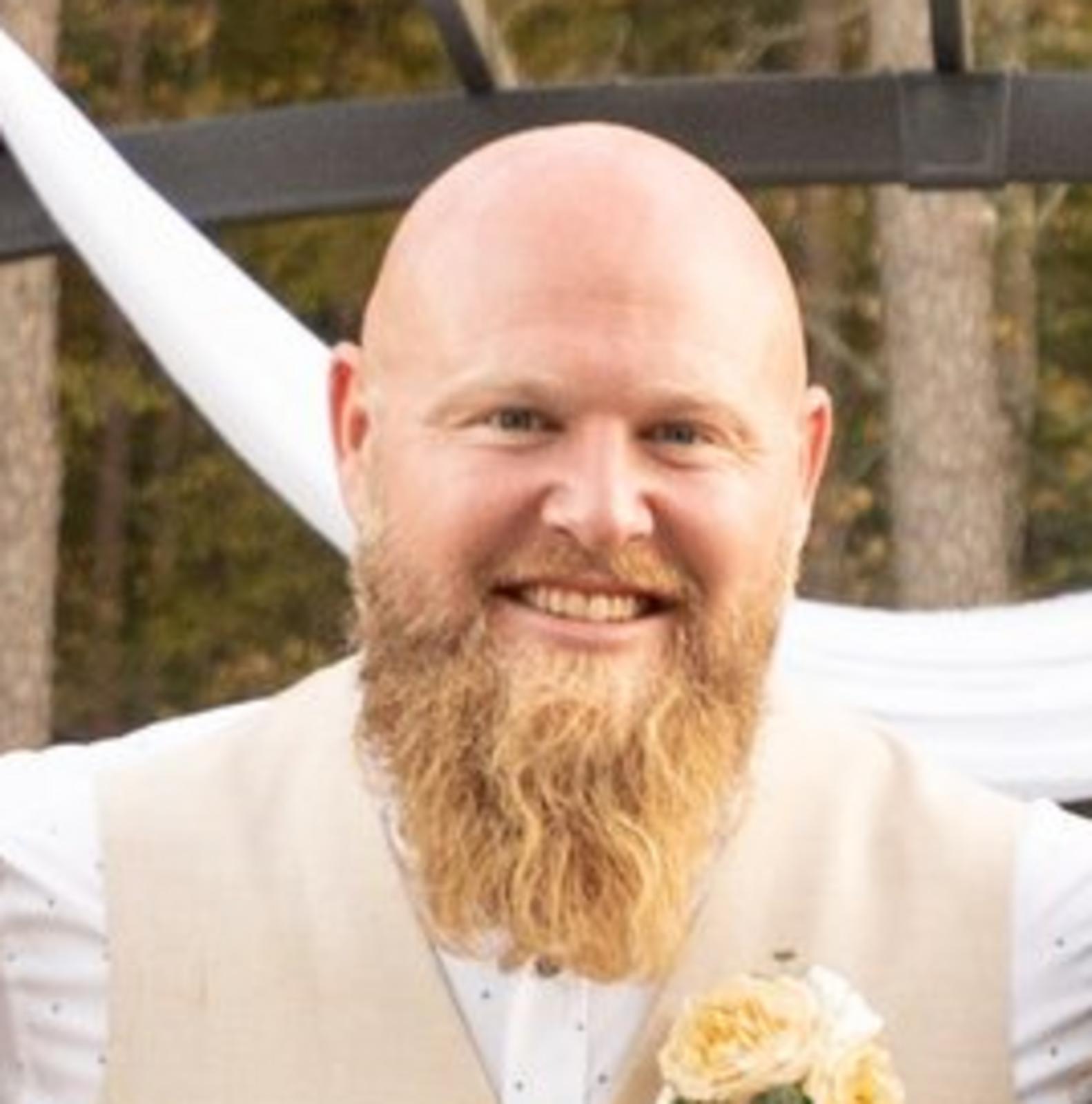 Justin E. Dues image
